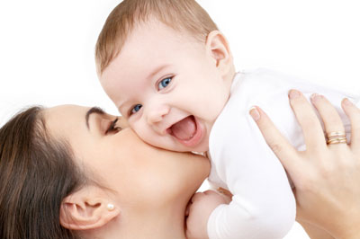 Photo of mother and laughing infant